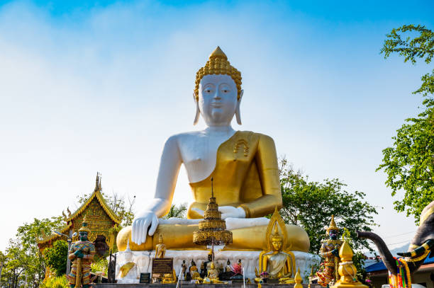 istock White Buddha statue of Phra That Doi Kham temple 1453031366