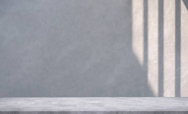 istock Empty gray cement loft wall and concrete floor with light and shadow on surface for editing products display and text present on free space background 1453038985