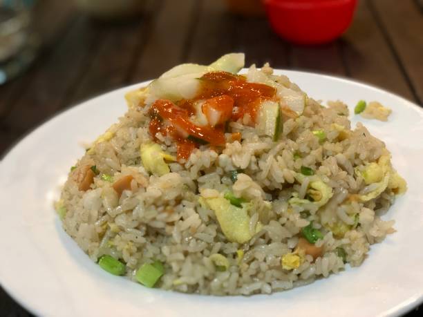 istock Fried rice with mixed vegetables and chili sauce 1453041190