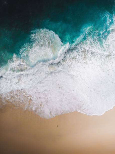 istock Aerial view of ocean waves with foam 1453043336