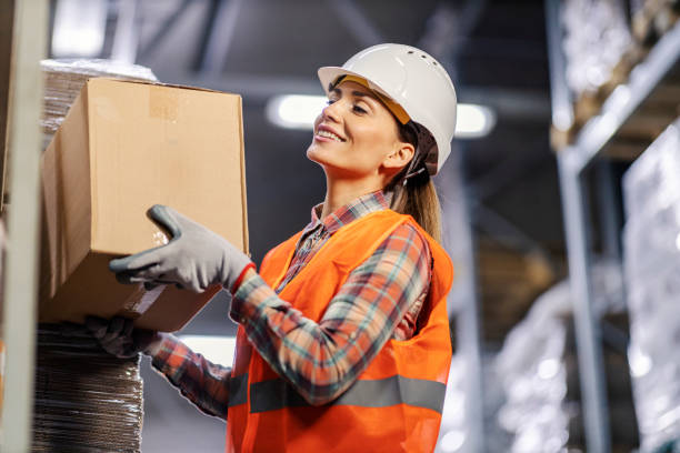 istock A female wholesale worker is arranging boxes on shelves in facility. 1453044662