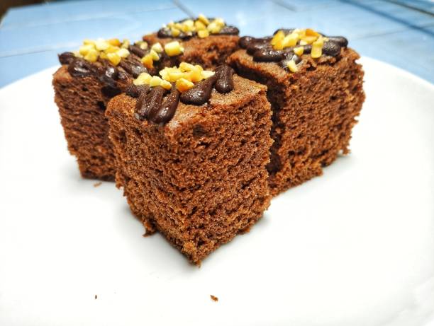 istock Delicious chocolate brownie texture with peanut topping and chocolate sauce. 1453044780