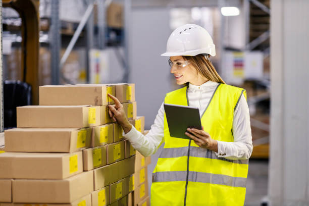 istock A storage supervisor is holding tablet in her hands and checking on shipment in boxes. 1453044876
