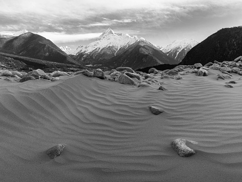 A grayscale shot of sand dunes in the Yarlung Zangbo Valley in Xizang province, West China