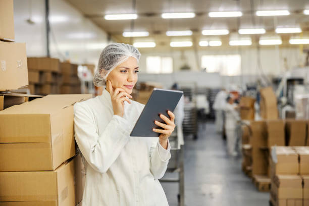 istock A food factory expert is thinking while looking at the tablet. 1453049443