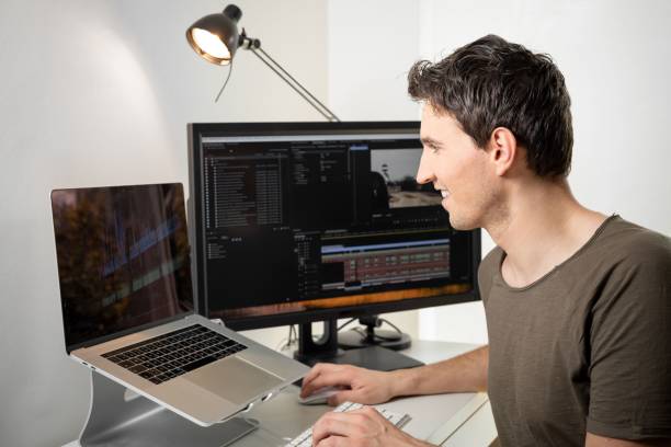 istock professional video editor on his desk editing an online video 1453051143