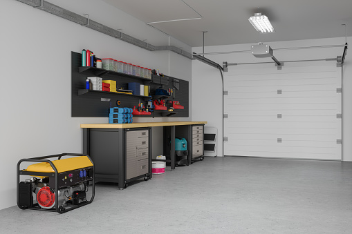 Empty Garage Interior With Working Equipments, Tools And Close-up View Of Electric Generator
