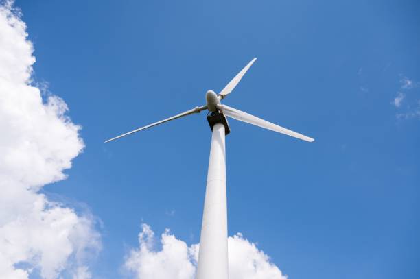 istock Low angle of a windmill against a blue cloudy sky 1453052557