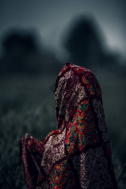 istock Back view of female head covered with a handkerchief 1453054411