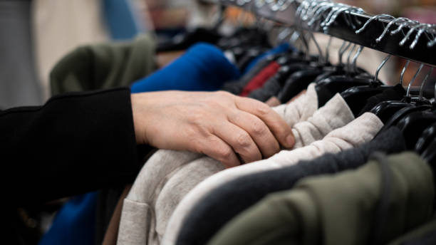 istock Woman choosing clothes in the store 1453057913