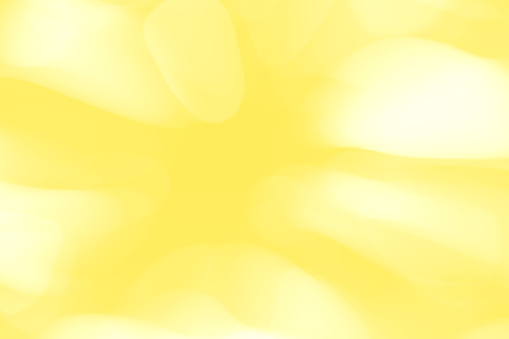Abstract motion blurred spots on a yellow background.