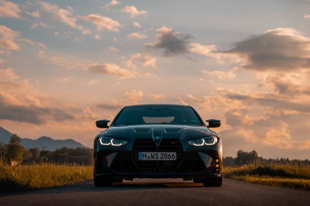 Cape Town, South Africa - November 26, 2023: BMW i8 parked on Camps Bay Beach at night