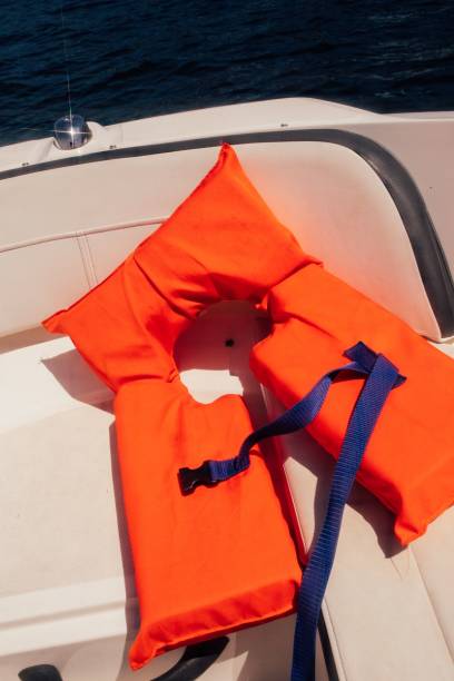 istock Orange life vest on boat deck 1453059905