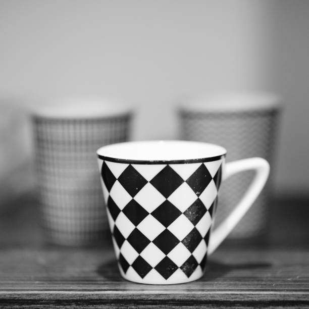 istock Grayscale shot of a cup in a shelf 1453060050