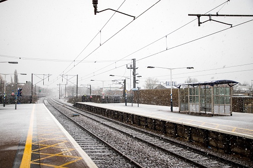 The view of the empty platform at the railway station in winter.
