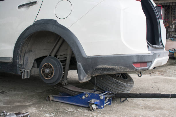 istock Car mechanic repaire tire wheels 1453062205