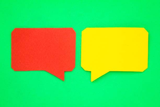 istock two red and yellow conversation boxes or bubbles with a green background 1453062684