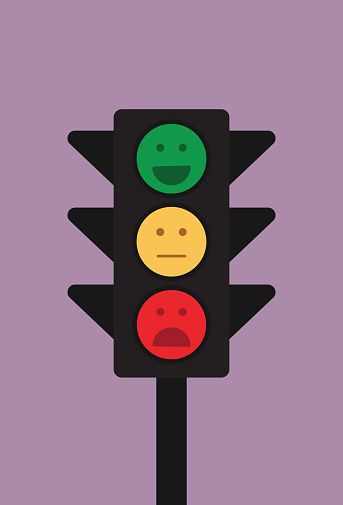 Traffic lights show an emoticon for mental health concept, facial expression in a traffic lights