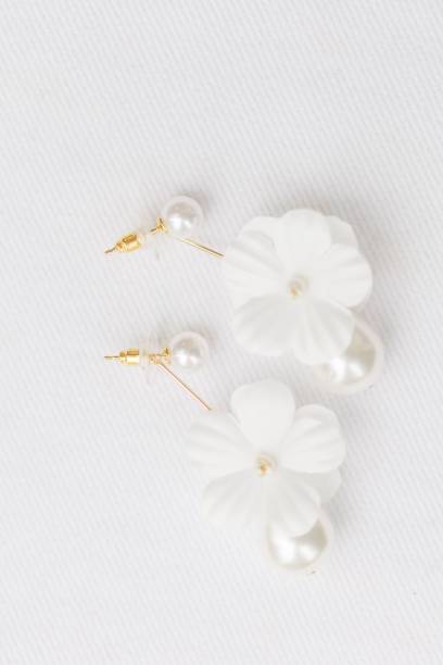 istock Elegant earrings with flowers and pearls 1453069266