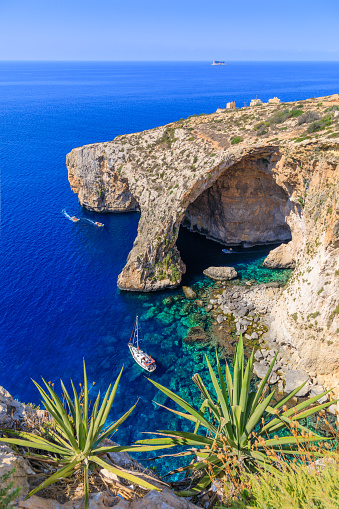 The Blue Grotto is a popular destination for tourists to Malta with boat trips visiting the caves running.  It is located near Wied iż-Żurrieq south of Żurrieq in the southwest of the island of Malta. The cave is a tourist spot renowned for its blue and turquoise green water of absolute transparency offering a perfect view of the seabed and the fauna and flora that inhabit it.