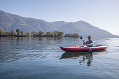 Man canoeing on a lake