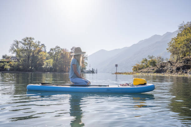istock Woman relaxes on stand up paddle 1453083155
