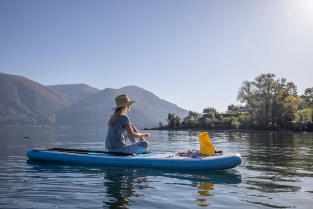 istock Woman relaxes on stand up paddle 1453083163