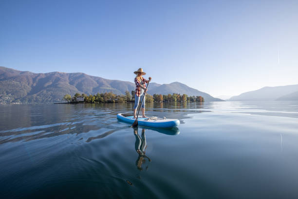 istock Woman stand up paddling on a lake 1453083237