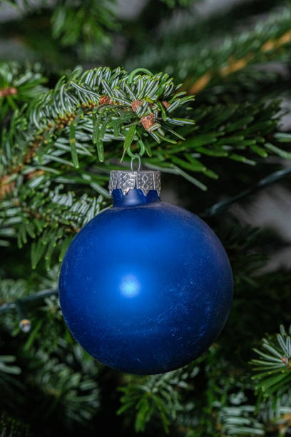 istock blue ball ornament christmas decoration on a tree 1453089725