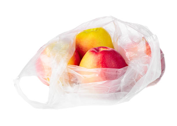 istock Apples in a plastic bag isolated on a white background. 1453089951