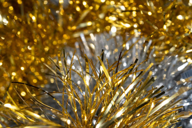 istock gold and silver Christmas tree tinsel decoration 1453092189