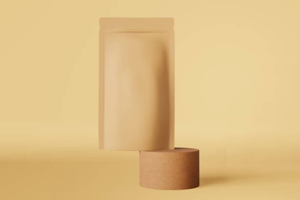 istock Balancing brown paper pouch bag coffee beans 3D rendering podium beige design. Merchandise doy pack product logo promo. 1453093862