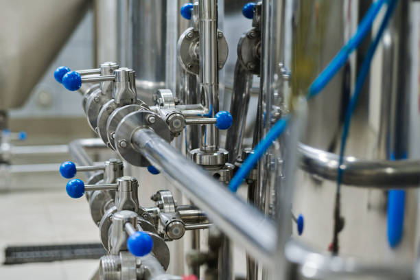 istock Metal pipes with levers on machinery 1453095341