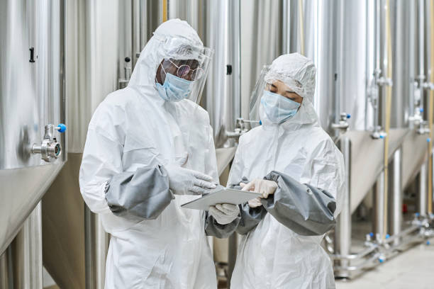 istock Workers working in team at chemical factory 1453095370