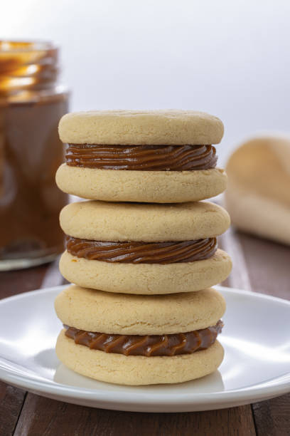 istock Stack of Argentinian alfajores made with cornstarch filled with dulce de leche. 1453095504