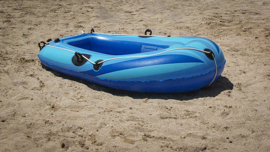 an inflatable boat on the beach