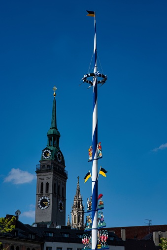 A low angle shot of a traditional bavarian maypole in Munich, Germany