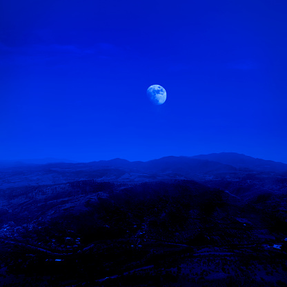 Mountains and moon at night