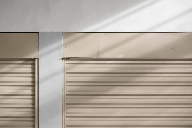 Garage door in building with security equipment.