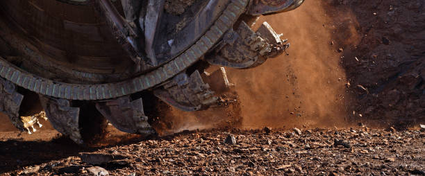 istock Bucket-wheel excavator during excavation at the surface mine. Huge excavator on open pit mine. 1453101463
