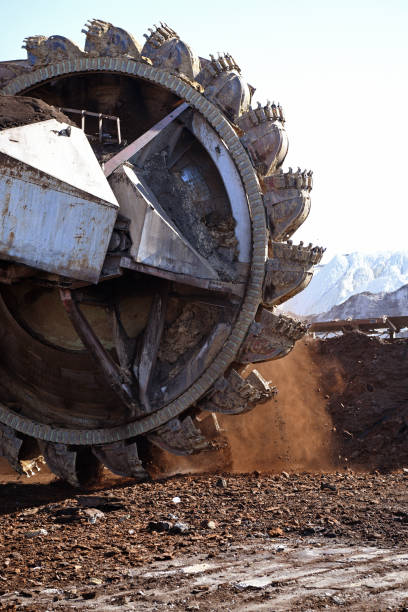 istock Bucket-wheel excavator during excavation at the surface mine. Huge excavator on open pit mine. 1453101466
