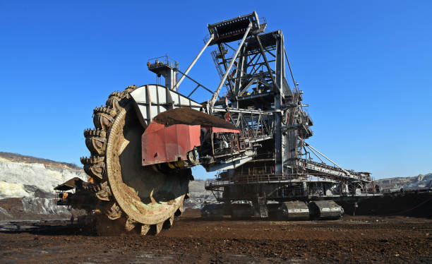 istock Bucket-wheel excavator during excavation at the surface mine. Huge excavator on open pit mine. 1453101487