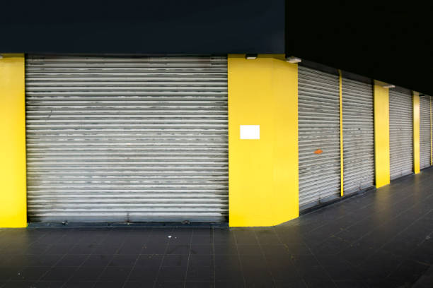 istock Roll up store front door of small business 1453101527