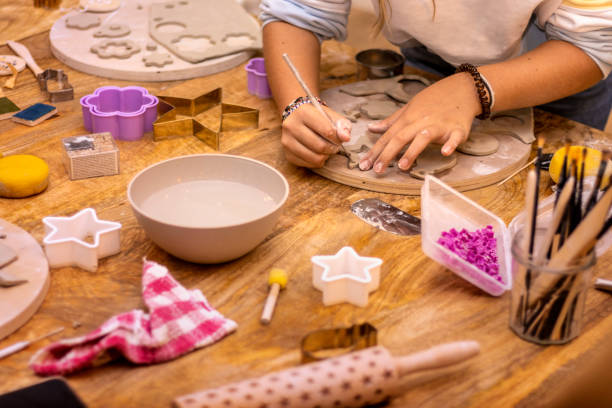 istock Teenager working the pottery with her hands. 1453102504