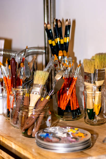 istock Brushes and tools of a paint shop. 1453102544