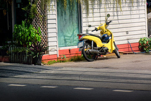 Close up  moped on sidewalk in Bangkok city