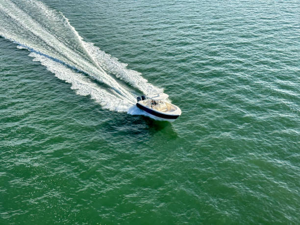 istock High angle view speedboat and water wake in sunny day 1453102836