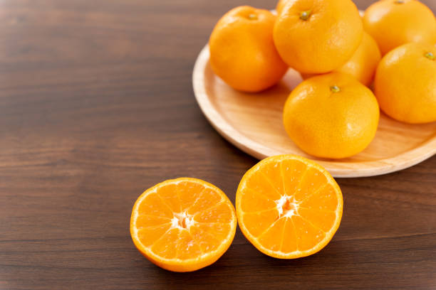 istock peeled tangerines and many tangerines 1453103857