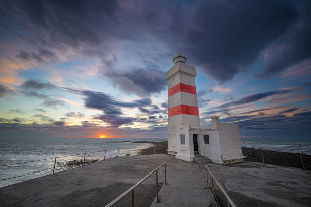 istock The old Gardur lighthouse at sunset, Iceland. 1453104956