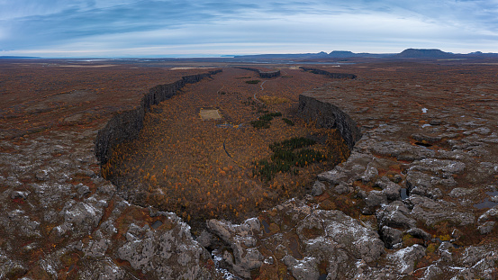 Asbyrgi horseshoe-shaped canyon in autumn aerial view, Iceland. 16:9 panorama.
